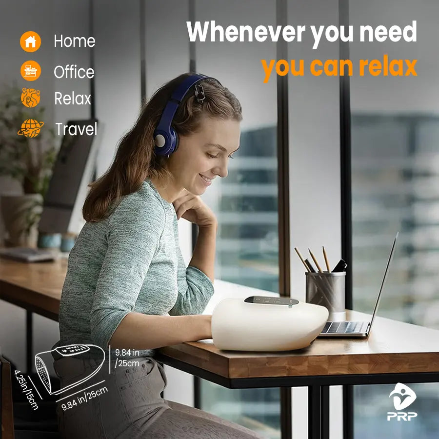 Woman working on laptop using PRP HandReflex portable hand massager, perfect for home, office, relaxation, and travel use.
