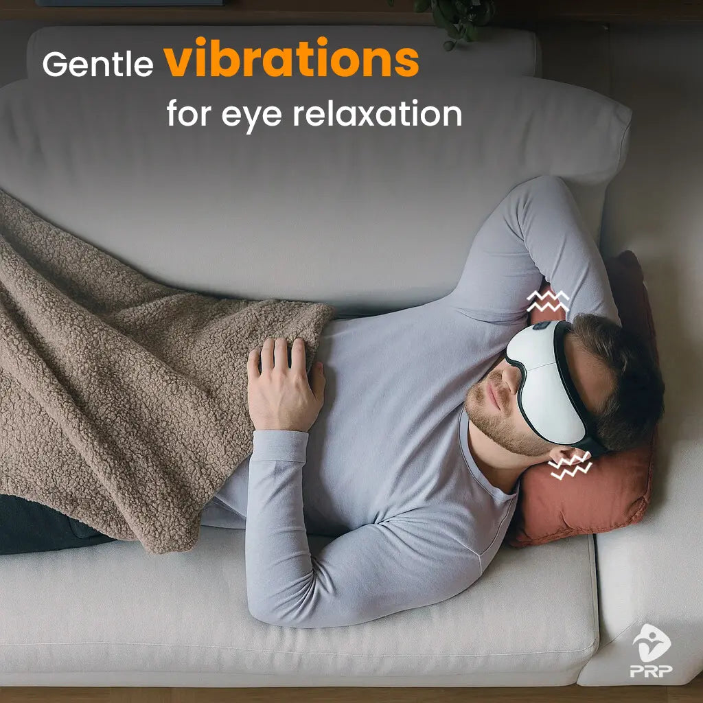 Man lying on sofa using vibrating eye massager, gentle vibrations to relax eye muscles and relieve stress.
