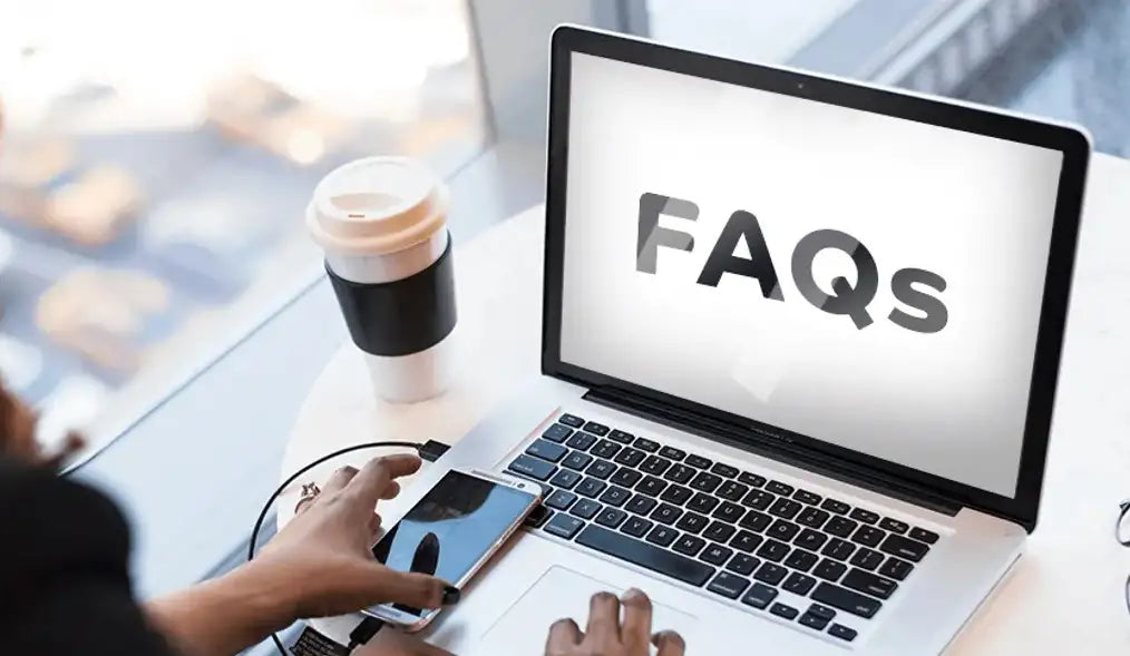 A person using a laptop to view the PRP FAQ page, a resource for customers to get answers to their questions.