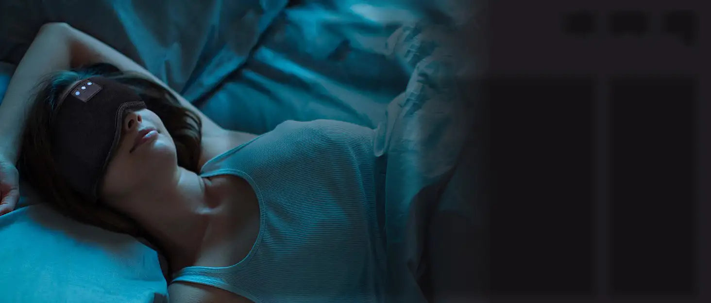 A woman peacefully sleeping in bed while wearing the PRP Bluetooth sleep mask headphones.