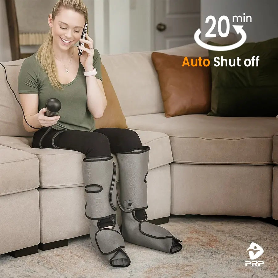 Young woman relaxing on sofa while using PRP® LegTech leg massager with air compression boots and handheld controller, featuring 20-minute auto shut off function.